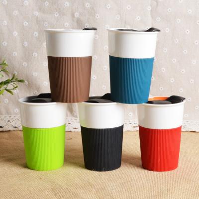 Cina Viable Customized Silicone PP Cover Insulated Jungle Ceramic Pattern Cup Mugs Ceramic Coffee Mug in vendita