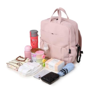 Китай Water Resistant Large Capacity Diaper Backpack For Newborn Baby Waterproof Cute Pink Diaper Bag For Mother продается