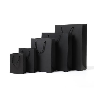 China Recyclable Vertical Black Version Black Gift Wrapping Paper Candy High Quality Simple Paper Box With Handle Wedding Birthday Party Favor Package for sale