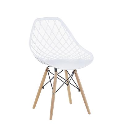 China Comfortable Nordic Design Back Armchair Hollow Cafe Shop PP Plastic Chair With Wooden Legs for sale