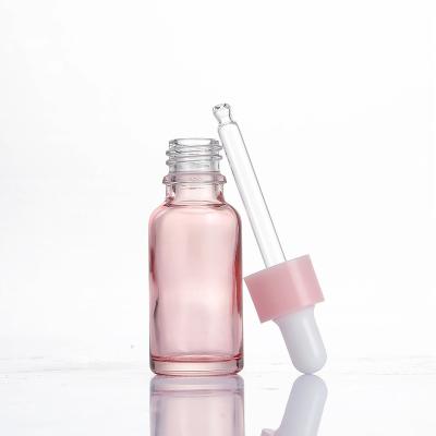 China Luxury Pink Glass Bottle Rose Gold Essential Oil Glass Bottles New Product Hair Oil Dropper Bottle 10ml 15ml 30ml 50ml 100ml Bottle for sale