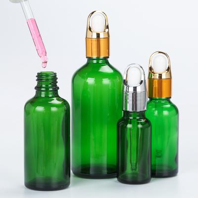 China 10ml 15ml 30ml 50ml 100ml cosmetic cosmetic packaging green glass essential oil dropper bottles for sale