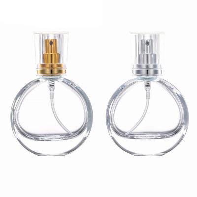 China Circular Clear Glass Empty Women Spray Bottle Personal Care 25ml 50ml 100ml Perfume Atomizer Spray Bottle Empty Spray Bottle for sale