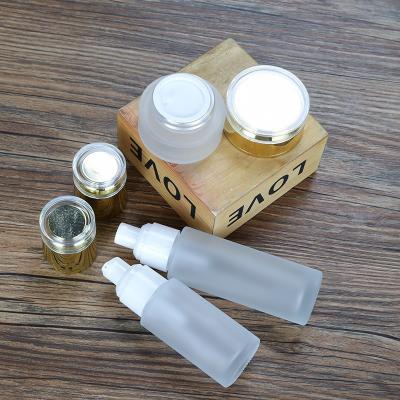 China 30ml 50ml 100ml luxury glass cosmetic packaging frosted glass lotion essential oil serum dropper pump bottle set for sale