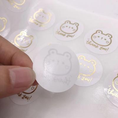 China Customized Printing Clear Stickers Waterproof Self Adhesive Logo Transparent Gold Foil Label for sale