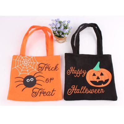 China Safe Wholesale Portable Nonwoven Halloween Bag Ghost Festival Kids Props Gift Candy Bag Halloween Handbags for sale