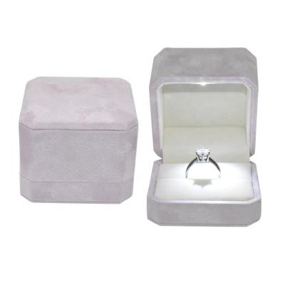 China Newest Fsahion Logo Luxury Velvet Jewelry Boxes Customized Octagonal Shape Wholesale Led Ring Box for sale