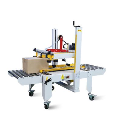 China Hotels Adhesive Tape Carton Sealer Machine For Heavy Cardboard Box for sale