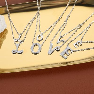 China New Design Popular Manufacturer Bling Necklace Women With Letter Dangling Letters With Girl for sale