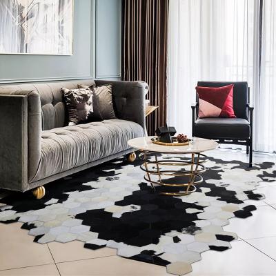 China Reversible imported cowhide irregularly spliced ​​European and American modern single rug for sale