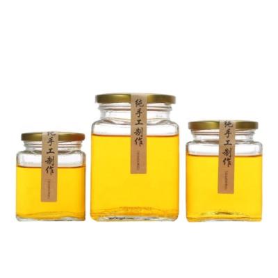 China Freshness Storage Wholesale Empty Hexagon Glass Honey Jars With Lid,Kitchen Clear Storage Glass Jars for sale