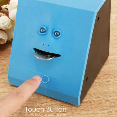 China Creative PVC UCHOME Gifts Face Eating Coin Saving Box Face Money Bank Crawling Piggy Bank for sale