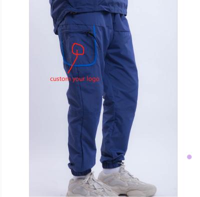 China Men's Sports Joggers Joggers Joggers Sweatpants Custom QUICK DRY Polyester Joggers Custom Embroider Logo Sports Pants For Men for sale