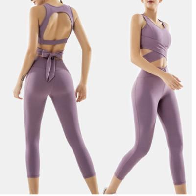 China Latest Yoga Suit 2 Piece Set Women Tracksuit Breathable Bra Solid Yoga Leggings Hollow Out Yoga Pants Sportswear Workout Set for sale