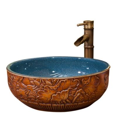 China Transitional Luxury Antique Round Brown Sculpture Birds Design Ceramic Wash Hand And Face Basin For Bathroom for sale