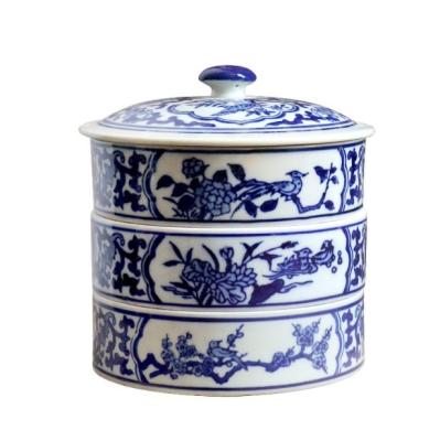 China Stored/Healthy/Eco-Friendly Eco-Friendly Round Blue And White Snack Pot Ceramic 3 Layers Storage Box Organizer for sale