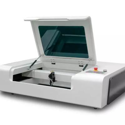 China Laser CUTTING Desktop CO2 Laser Engraver for sale