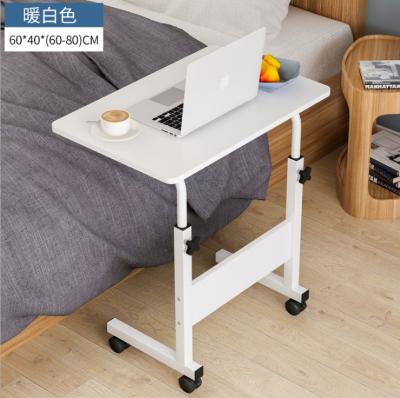 China Notebook Lift Table Foldable Thickened Wood Desk Wheeled Bedroom Learning Table for sale