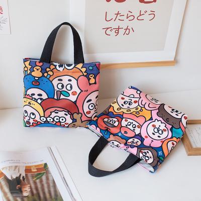 China 2022 New Wholesale High Quality Handbag School Women Girl Lunch Bag To Work Hand Carry Printed Canvas Tote Bag For Kids School for sale