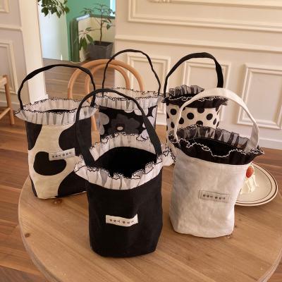 China 2023 High Quality Wholesale Fashion Polka Dot Women Lady Shoulder Tote Cute Bag Lace Up Portable Small Bucket Bag Canvas Phone Bag for sale