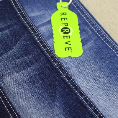 China Factory Wholesale Super Soft Stretch Repreve Denim Fabric Mill Make From Recycled Plastic Bottles With Tag For Women Pants for sale