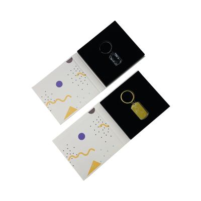 China Biodegradable Custom Jewelry Display Book Shape Master Packaging Chain Box With Black Cutout Foam Insert for sale