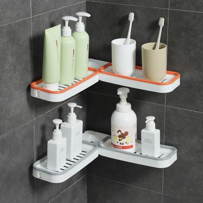 China Wall Mounted Rotatable Folding Storage Rack Plastic Kitchen Bathroom Storage Corner Rack Viable for sale