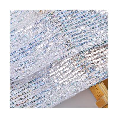 China Fashion Breathable Stripe Mesh 3MM Laser Sequin Embroidery Fabric Shiny Light Silver Holographic Sequin Fabric for sale