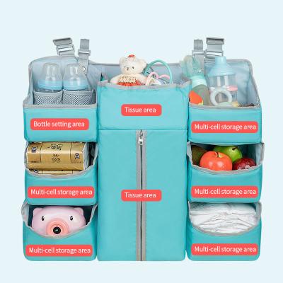 China Popular baby stocked hanging bags, diapers, bedside clothes, finishing and storing oxford cloth storage bags. for sale