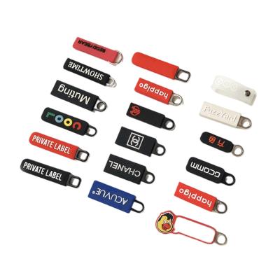 China Other manufacturers supply clothing bags glue zipper puller silicone pull label PVC soft LOGO plastic zipper puller for sale