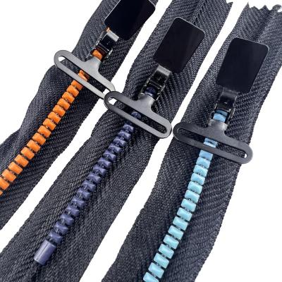 China Sustainable Adjustment Buckle Track Slider Zipper Resin Zipper for sale