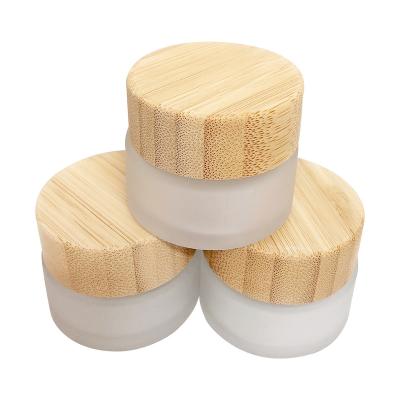 China Luxury Refillable Skin Care Body Packaging Container Empty Refill Cosmetic Glass Jar With Bamboo Lid for sale