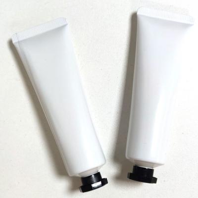 China Customized Personal Care Logo 30ml 100ml Plastic White Hand Cream Flat Soft Squeeze Bottle for sale