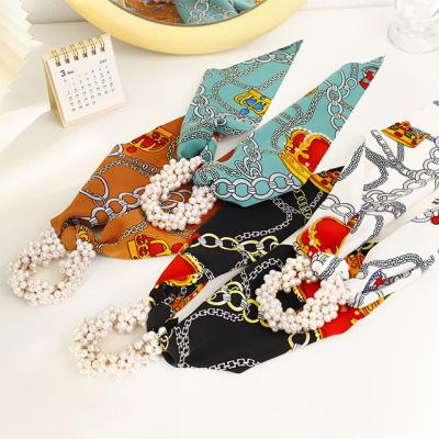 China Girls Hair Decoration Fashion Women Printed Bow Elastic Ponytail Flame Ties Floral Pearl Hair Scrunchies for sale