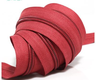 China Eco-friendly Nylon Invisible Reverse Roll Zipper Coil Long Chain Red Sewing Zipper Zippers For Bags for sale