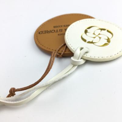 China Sustainable High Quality Leather Small Hanger Tag Debossed For Clothes for sale