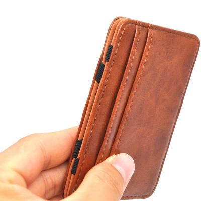 China Money+credit Hold Front Pocket Wallet Card with Card Slots Mens Money Clip Pocket Elastic Genuine Leather Credit Card Holder for sale