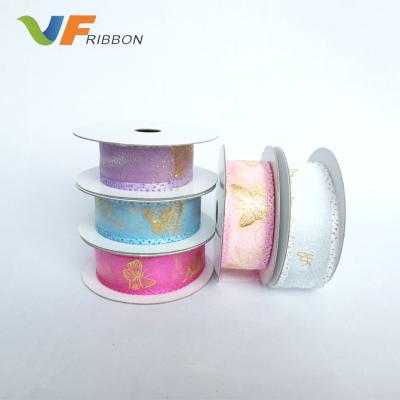 China Trendy designs wholesale 25mm ultrasonic embossing ribbon with butterfly gold foil printing organza ribbon for sale