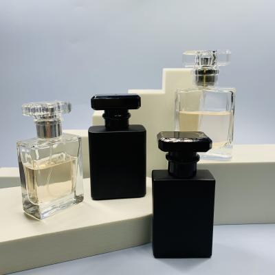 China 30ml 50ml 100ml Refill Glass Bottle Empty Perfume Bottle Cosmetic Wholesale Luxury Square Cap Spray Bottle Packaging for sale