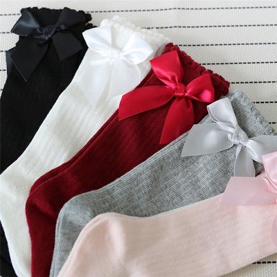 China Anti-Fault 5 Solid Colors Ruffle Knee High Organic Cotton Baby Bow Socks for sale