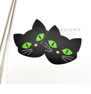 China Invisible Women Underwear Satin Fabric Black Cat Shape With Green Color Disposable Eyes Nipple Cover for sale