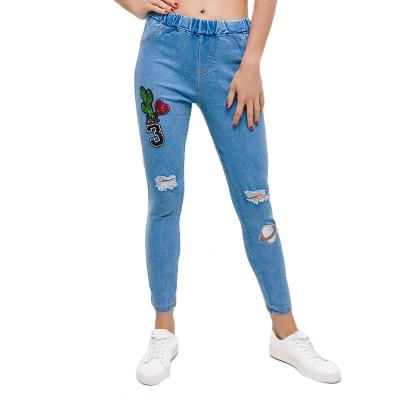 China Breathable embroidery jeans light blue elastic denim fabric bodycon style skinny knee holes pencil pants for women for sale