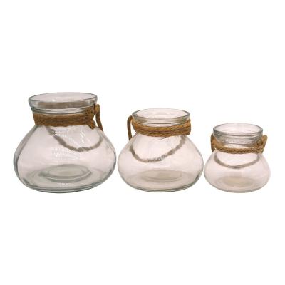 China Traditional clear garden candle holder decorative glass jar with hemp rope handle for sale