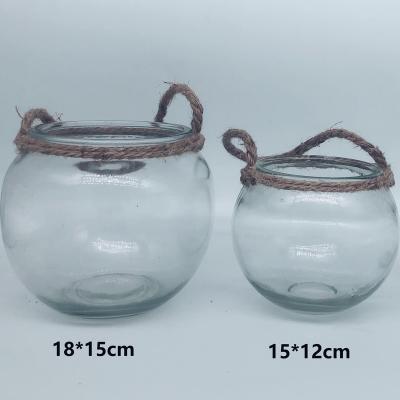 China Traditional clear garden candle holder decorative glass jar with hemp rope handle for sale