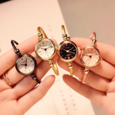 China Hollow Out Small Gold Bangle Watches Stainless Steel Luxury Ladies Retro Quartz Wristwatches Fashion Casual Women Dress Watch for sale