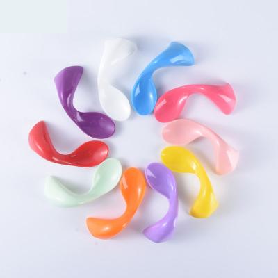 China BPA Free Factory Direct Small Deep Training Chewing Curved Handle Baby Spoon for sale