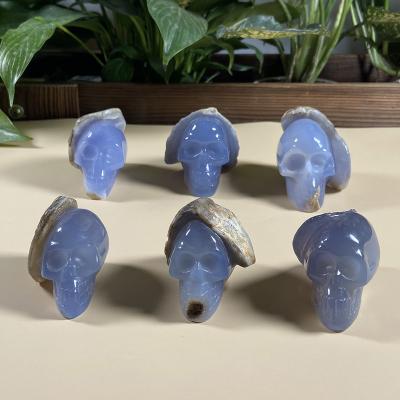 China Wholesale China Home Decor Product Hand Carved Blue Chalcedony Crystal Geode Skull For Healing for sale