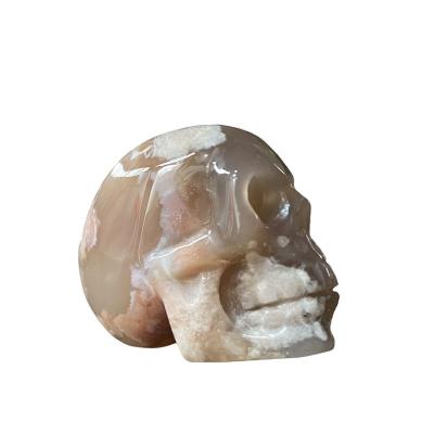 China Europe Natural Handmade Carving Crystals Bulk Wholesale Sakura Agate Human Skulls Craft Art For Healing for sale