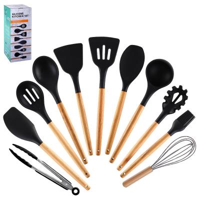 China Black Silicone Kitchen Utensils 11 Pieces Kitchen Accessories Minimalist Promotional Non-stick Wooden Handle Kitchen Utensils for sale