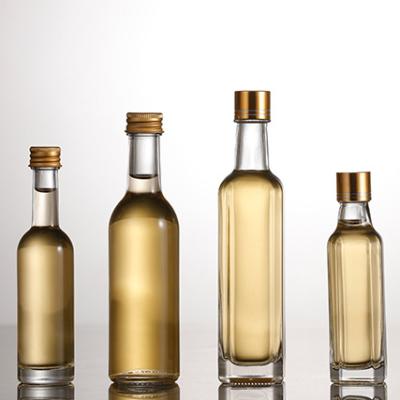 China Different Sizes 30ml 50ml 100ml Clear Glass Cooking Oil Bottle For Olive Oil for sale